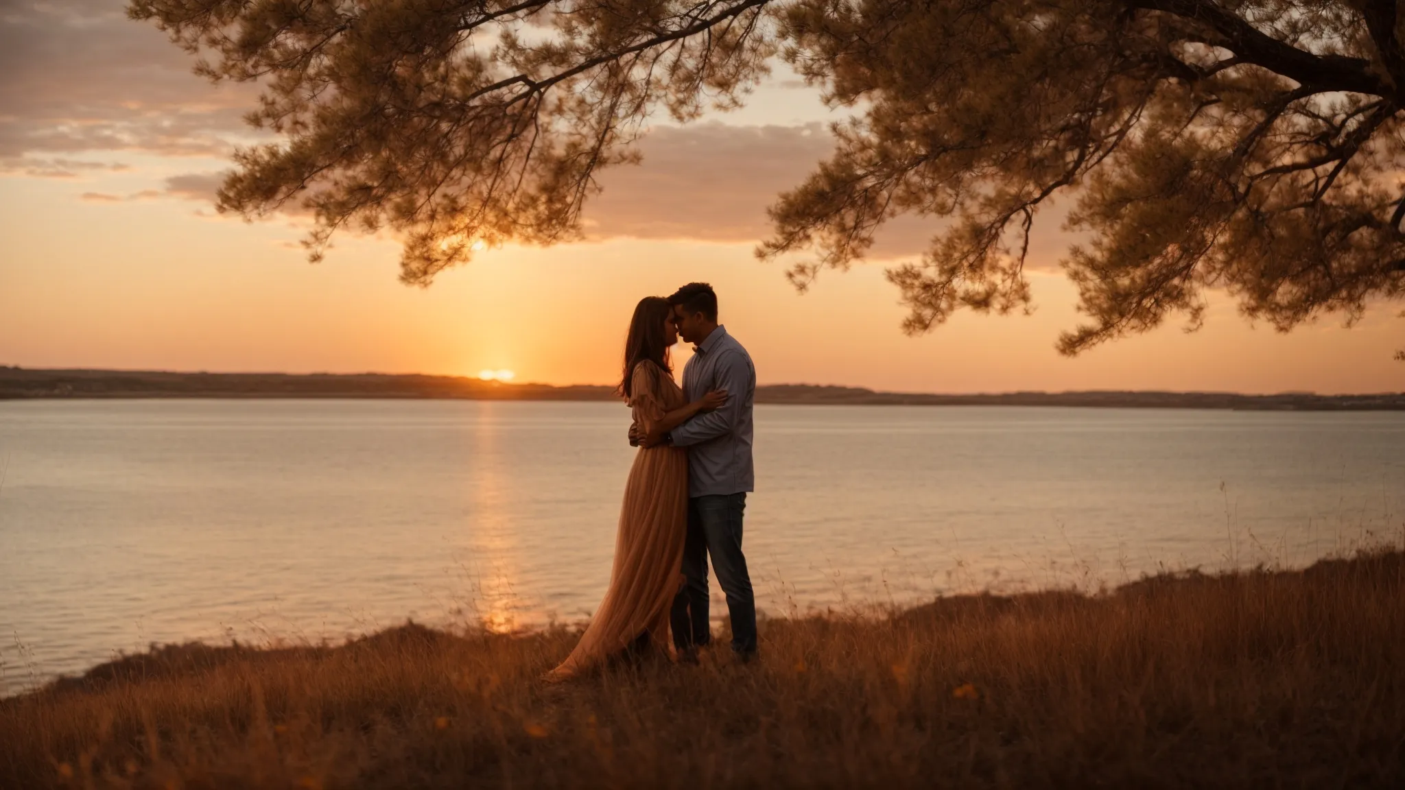 a couple shares a tender moment amidst a picturesque sunset, symbolizing the start of their journey together.