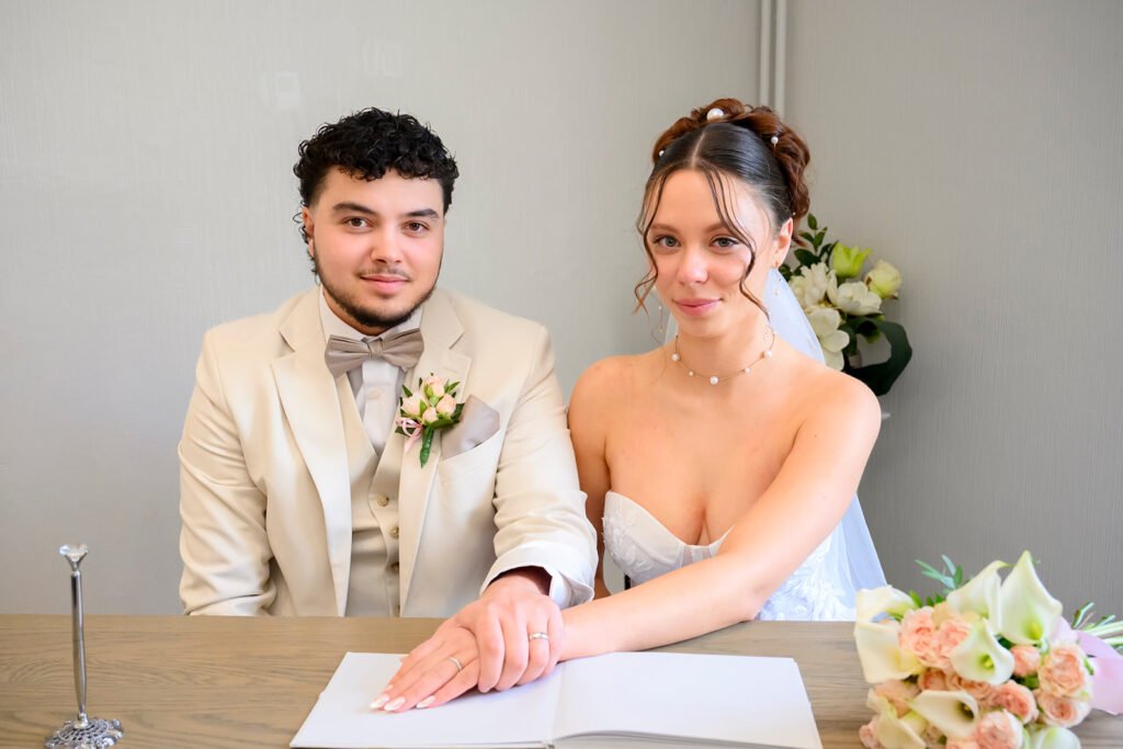 Sandra and Chase signing the marriage register at Sandwell Register Office.