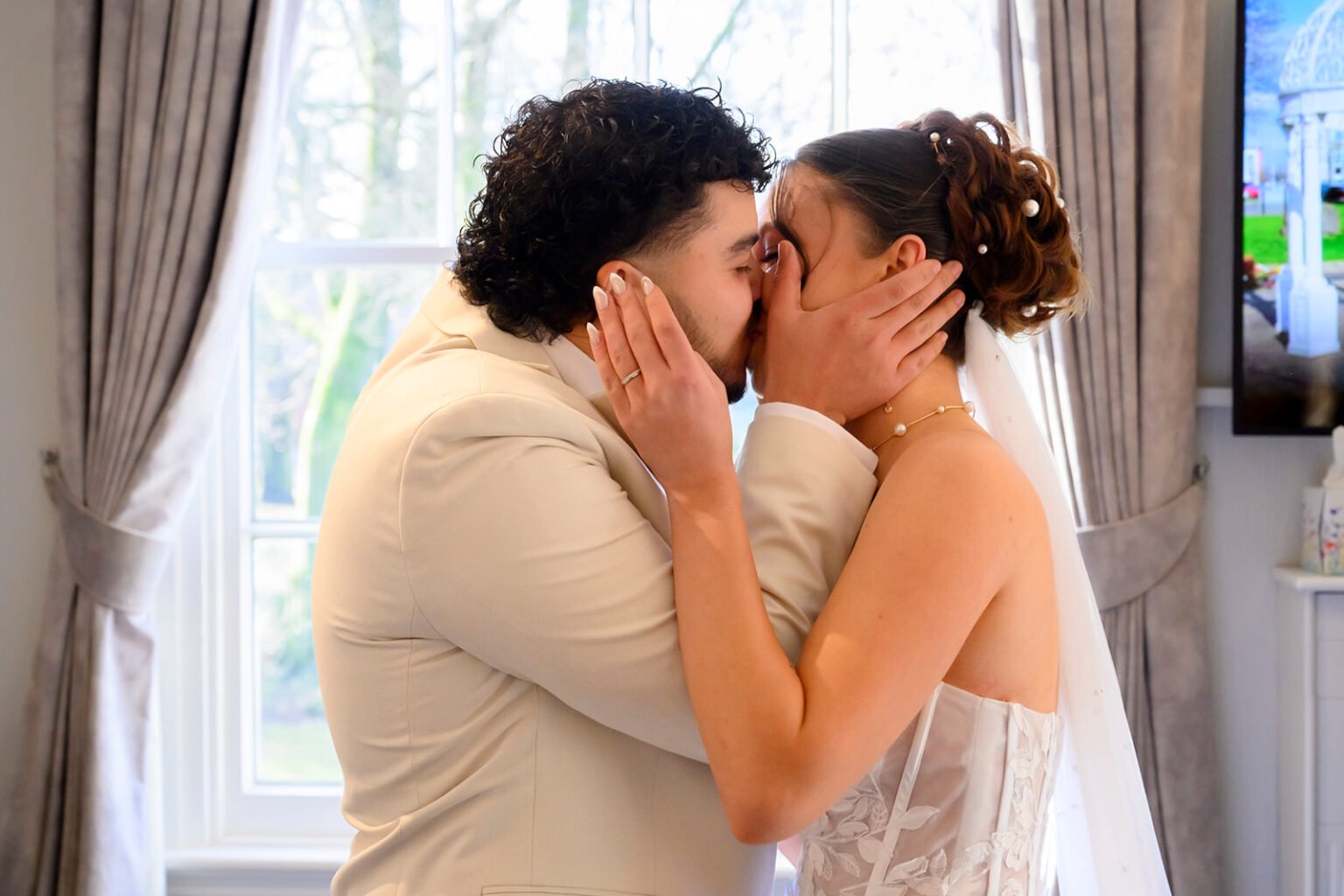 Newlyweds sharing their first kiss at Sandwell Registry Office