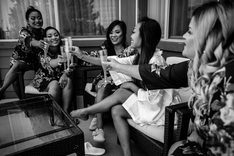Bride and bridesmaids sharing a champagne toast before the ceremony