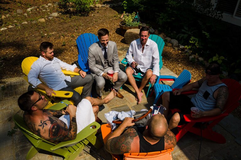 Groom relaxing with friends before the wedding ceremony