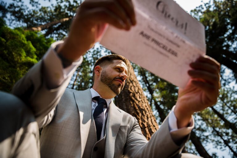 Groom reading a private letter before his wedding ceremony