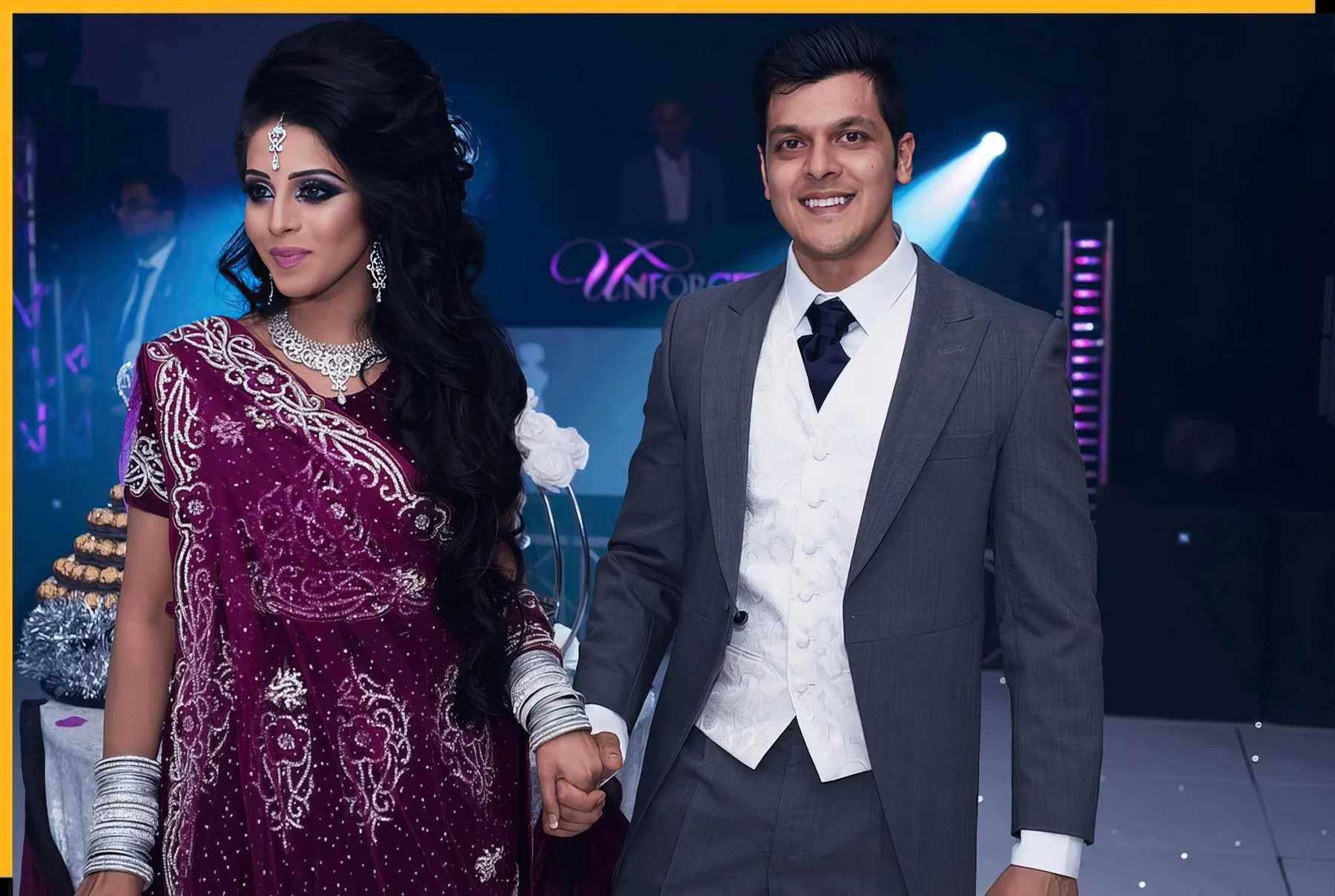 Asian wedding couple holding hands during their evening reception