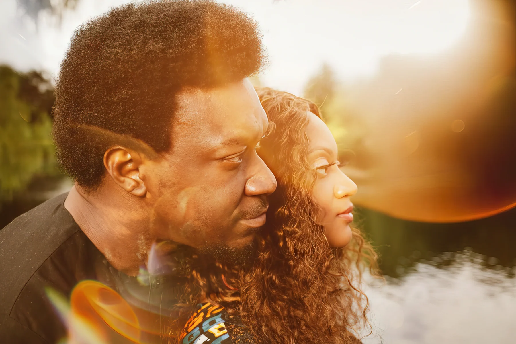 Golden-light couple portrait | Ikonic Media Close-up portrait of a couple leaning together in warm golden sunlight