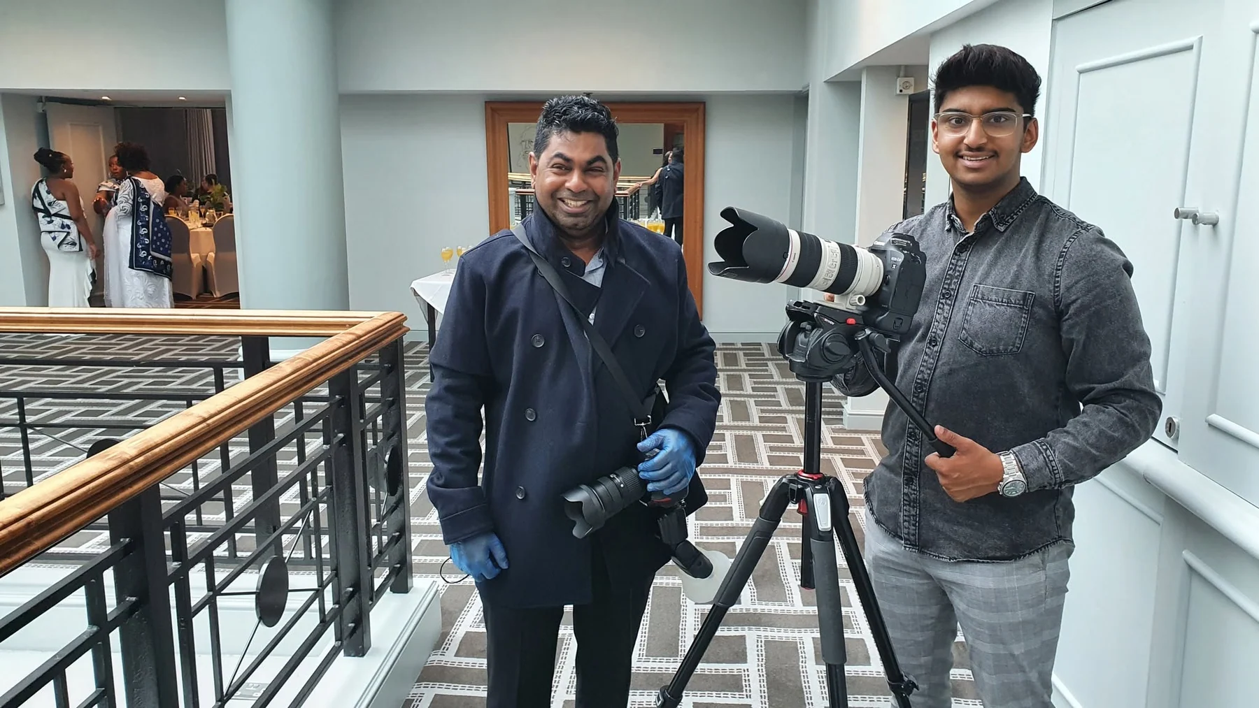 Diven Laxman and an Ikonic team member with cameras at a wedding venue