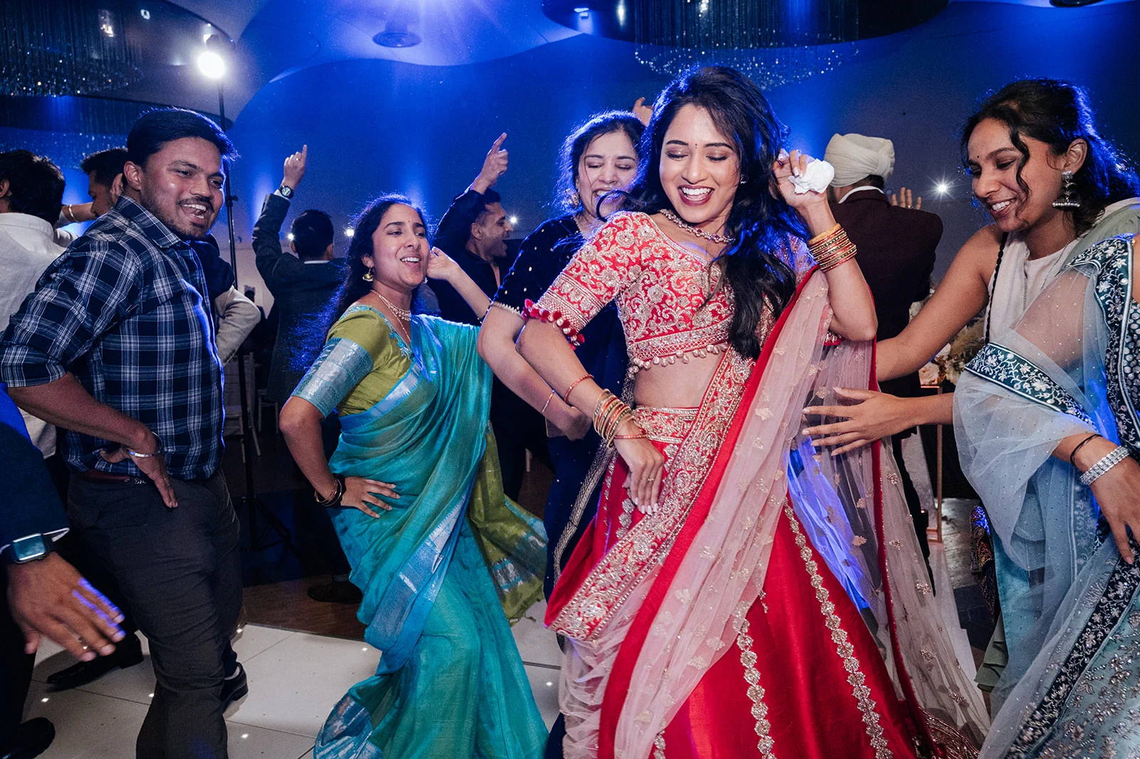 Meghana dancing with family and friends during her engagement celebration