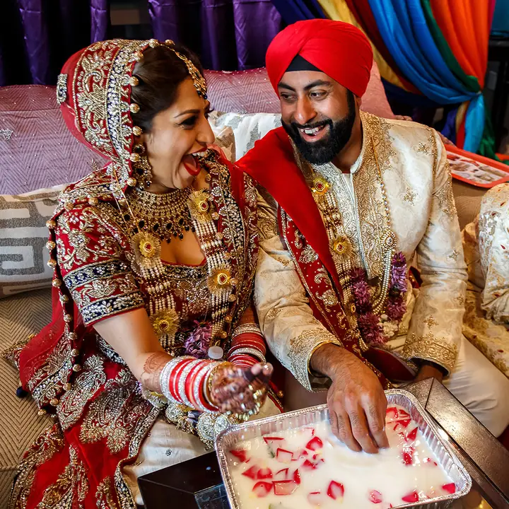 Newlyweds laughing together during their wedding celebration