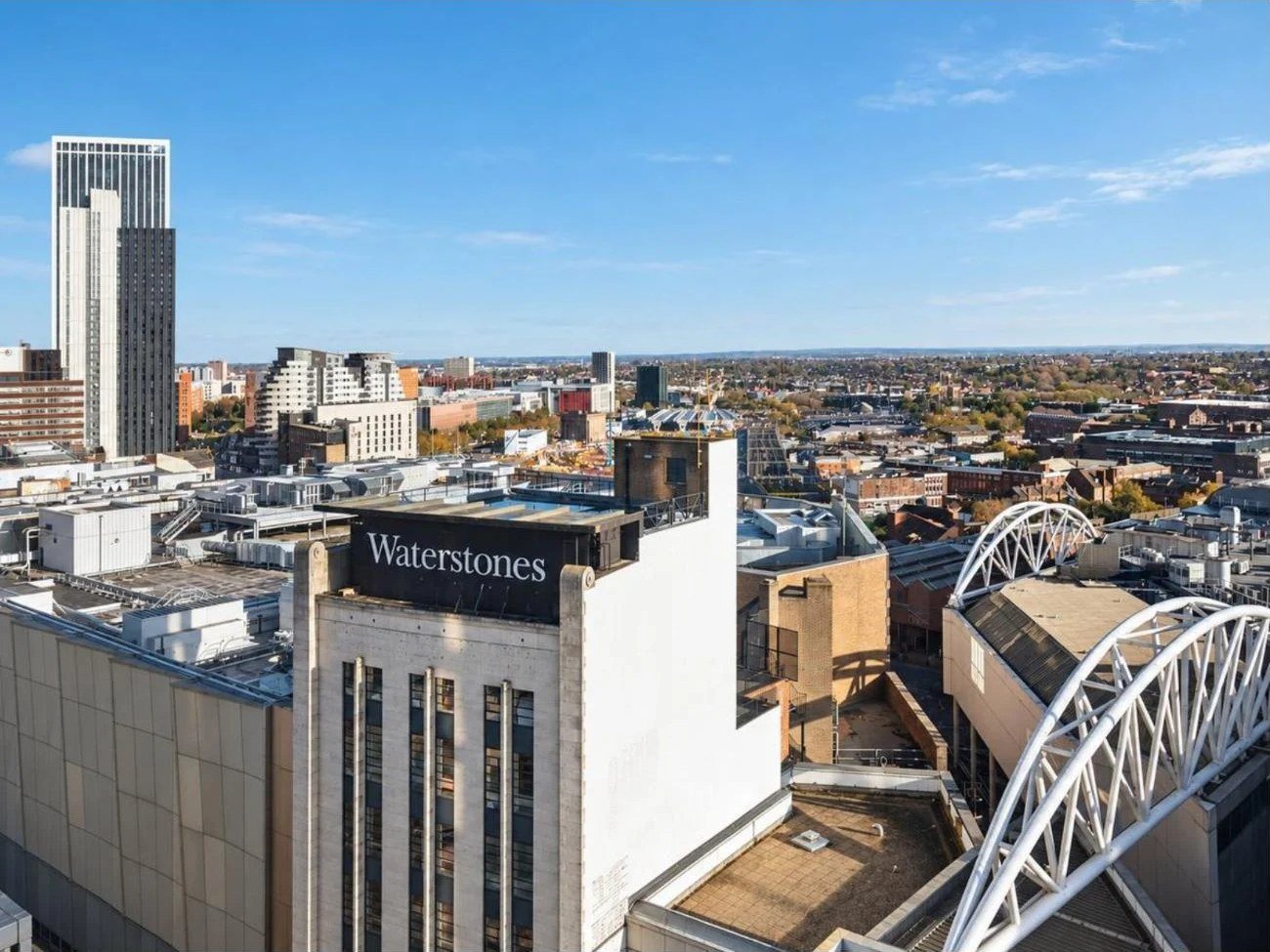 Birmingham city centre skyline view from a high-rise Airbnb apartment, photographed for a short-term rental listing
