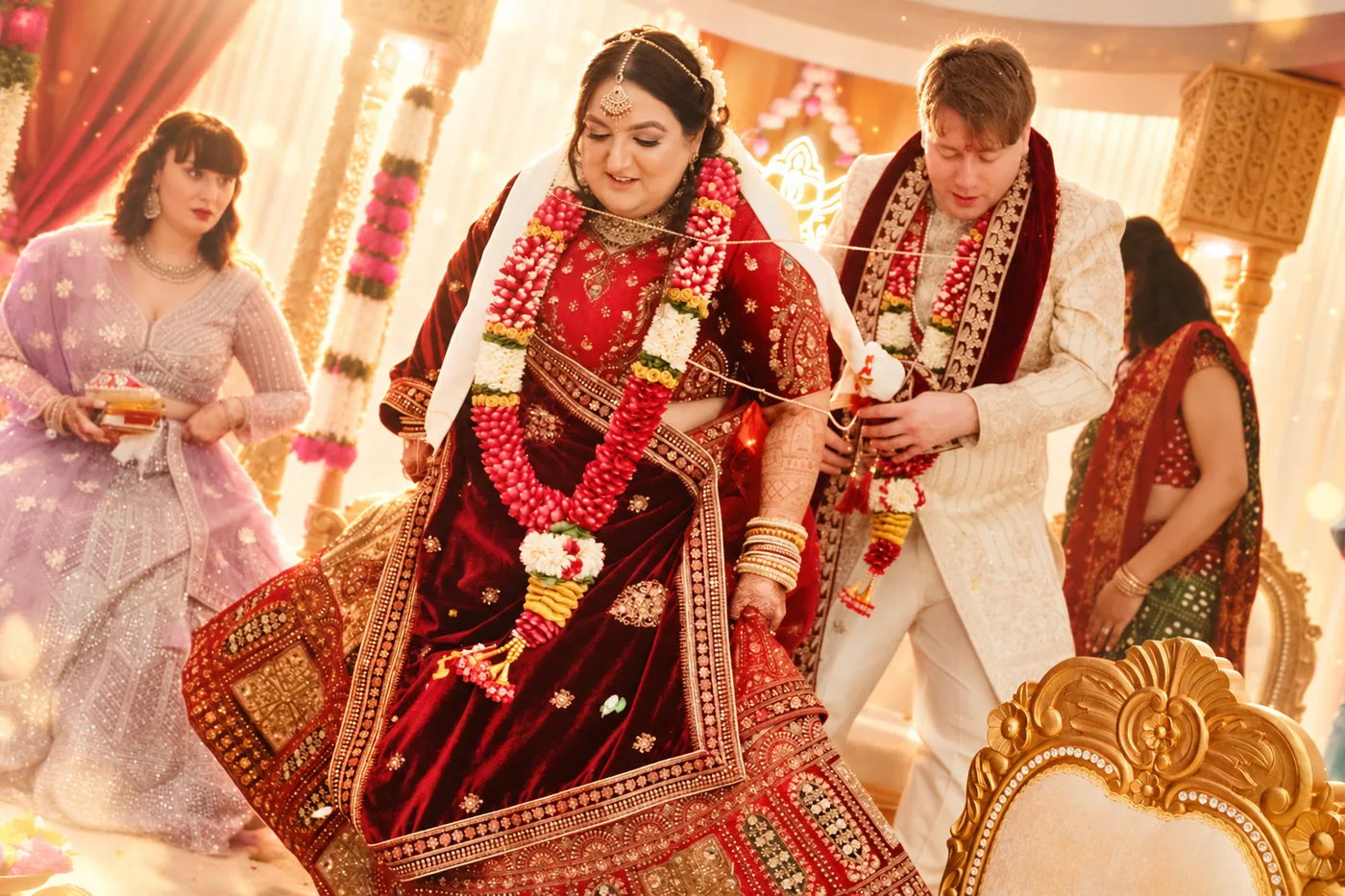 Bride and groom taking the seven steps of the saptapadi at a Hindu wedding ceremony near Birmingham
