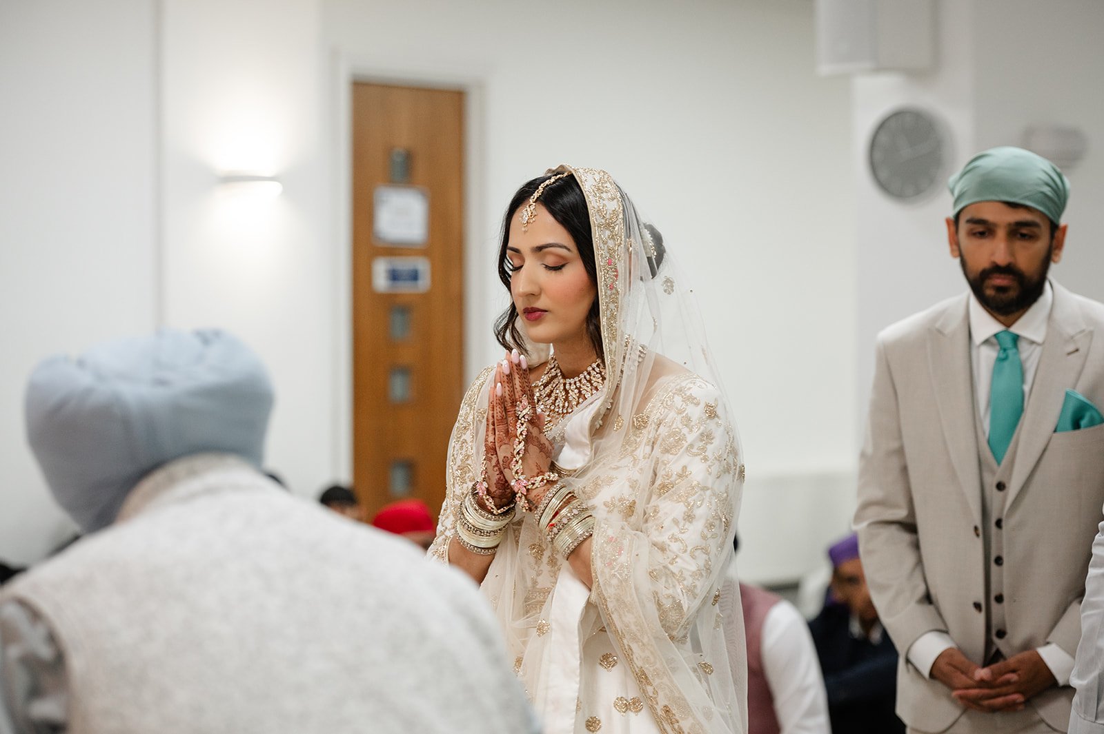 Bride with hands together in prayer