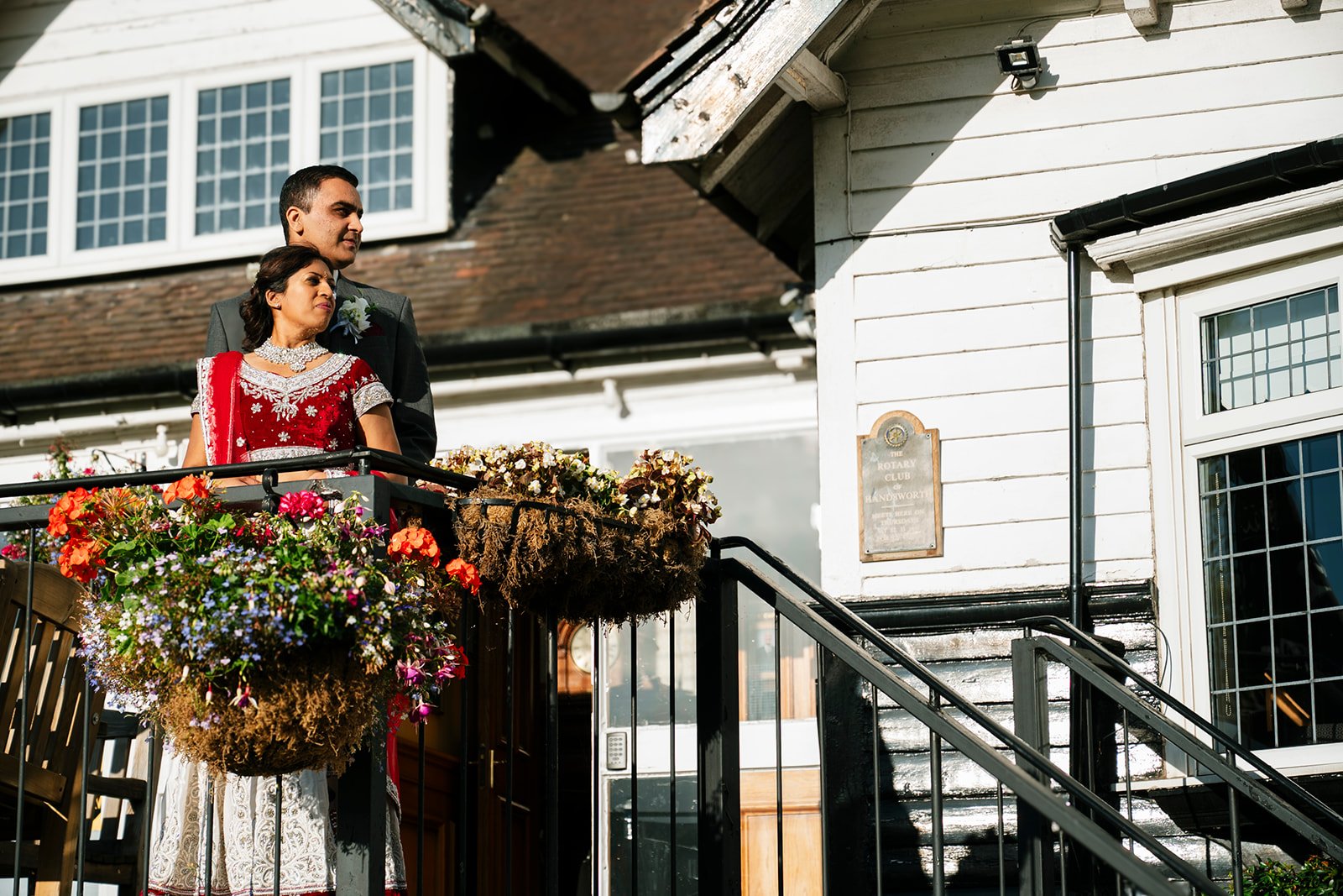 Indian bride and groom together outside their wedding venue
