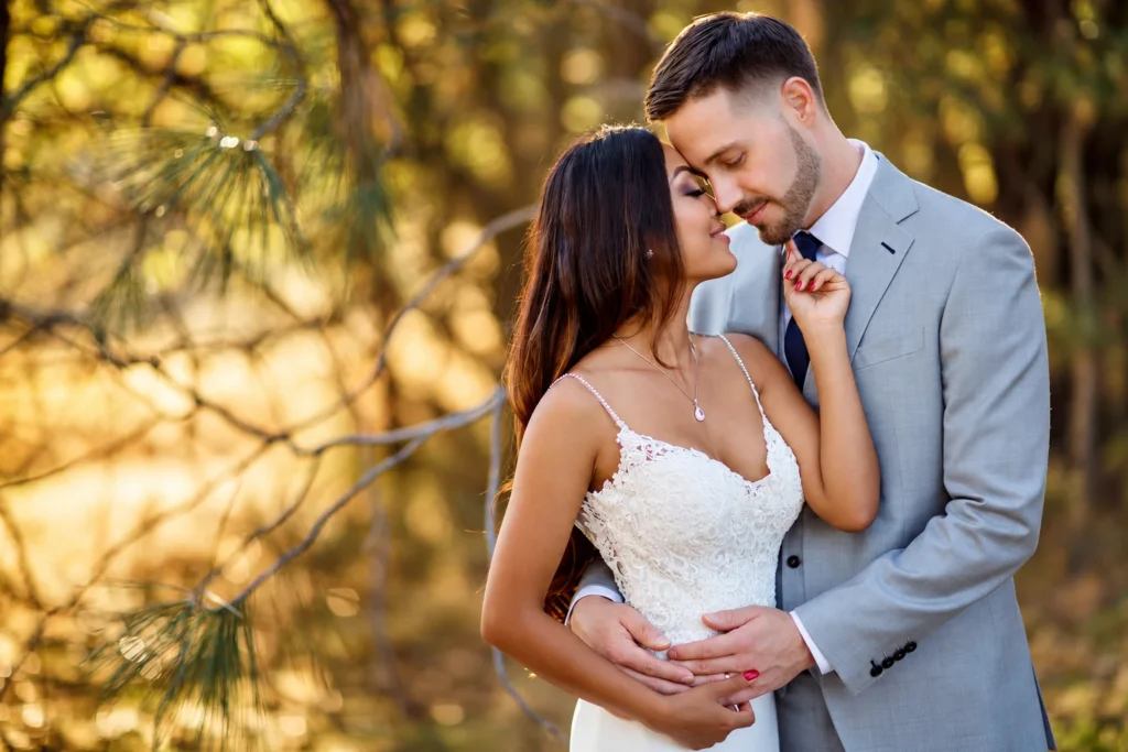 Bride and groom sharing an intimate golden-hour wedding portrait